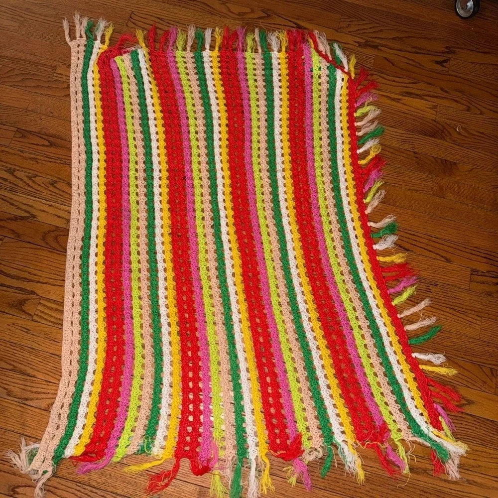 3.1.5 multicolored crochet throw blanket with a striped pattern and fringe trim